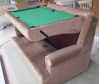 Illustration for article titled This Couch Turns Into a Snooker Table